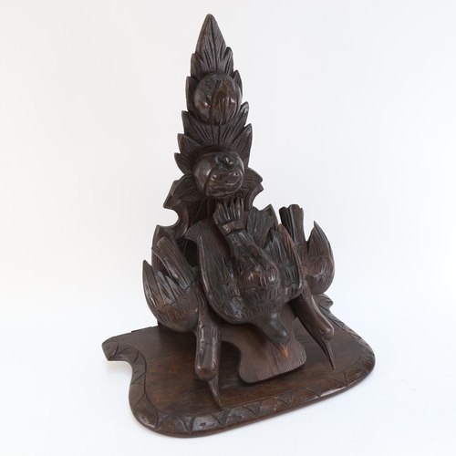 574 - A Black Forest carved wood wall  bracket, supported by 3 birds, height 46cm