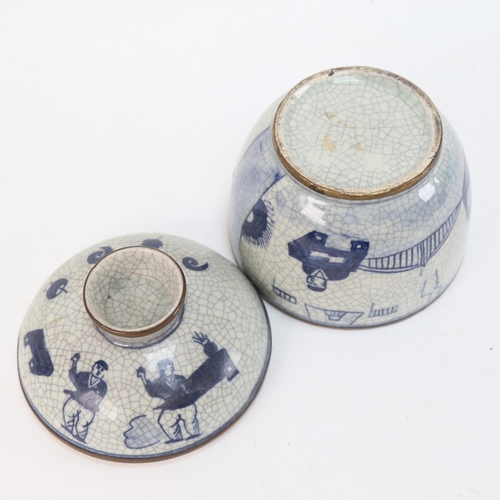 583 - A Chinese blue and white crackle glaze jar and cover, with brass mounts, height 15cm