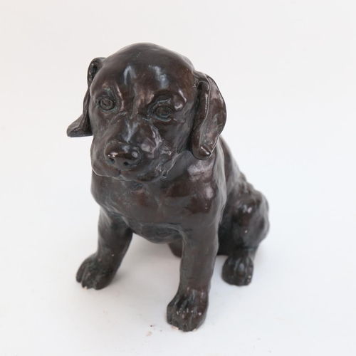 584 - A painted pottery puppy sculpture, 24cm