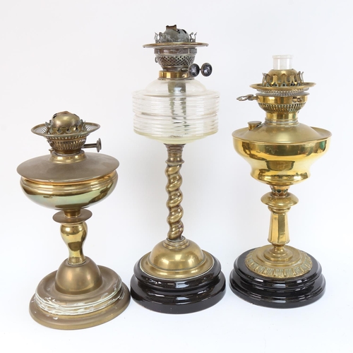 596 - A Victorian brass twist oil lamp on plinth, with moulded glass font, height 48cm, and 2 other brass ... 