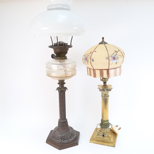 597 - A Victorian oil lamp, with moulded glass font, height 75cm, and a brass Corinthian column electric l... 