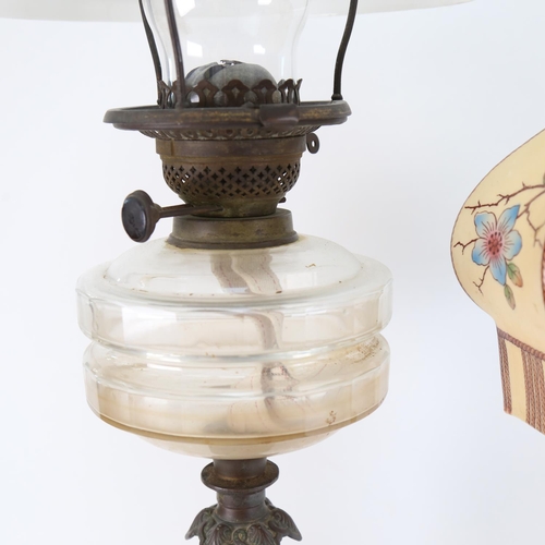 597 - A Victorian oil lamp, with moulded glass font, height 75cm, and a brass Corinthian column electric l... 