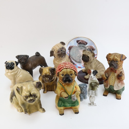 603 - A collection of ceramic and other dog figures, including Pugs and a Jack Russell etc