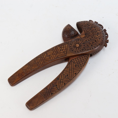 610 - A Scandinavian carved wood nutcracker, 19cm