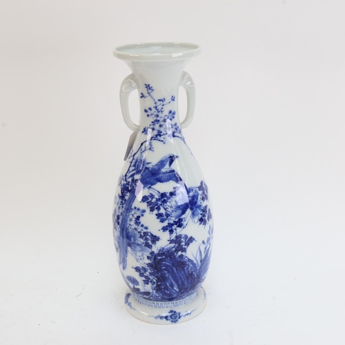 618 - A Japanese porcelain blue and white vase, signed, 33cm