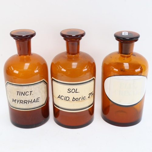 622 - A Vintage set of 3 brown glass apothecary bottles and stoppers, height 23cm (3)