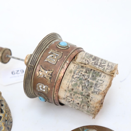 629 - A turquoise inlaid copper prayer wheel, a bell (lacking clapper), and an ivory figure (A/F), 13.5cm