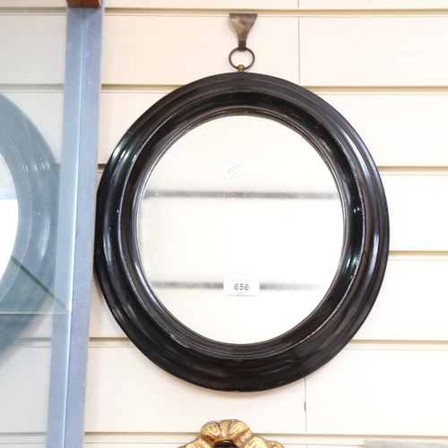 656 - An oval Regency mirror, height 35cm