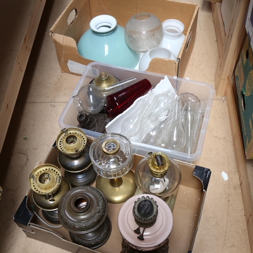 670 - 3 boxfuls of oil lamp spares, chimneys, globes, and bases