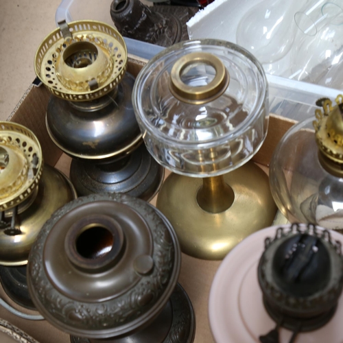 670 - 3 boxfuls of oil lamp spares, chimneys, globes, and bases