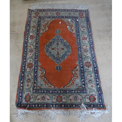 2095 - An orange ground Afghan design rug, 127cm x 82cm