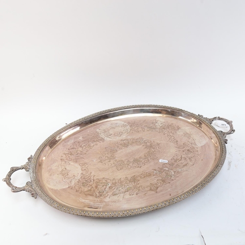 646 - Silver plated tea tray with engraved decoration, 73cm overall