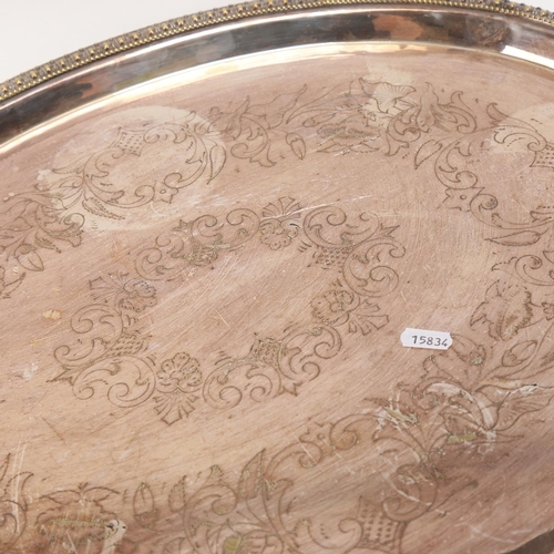 646 - Silver plated tea tray with engraved decoration, 73cm overall