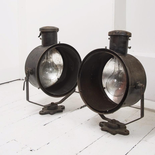 667 - A pair of early 20th century stage lights, with mercury glass reflectors and original paint finish, ... 