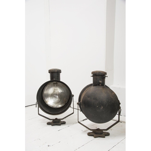 667 - A pair of early 20th century stage lights, with mercury glass reflectors and original paint finish, ... 