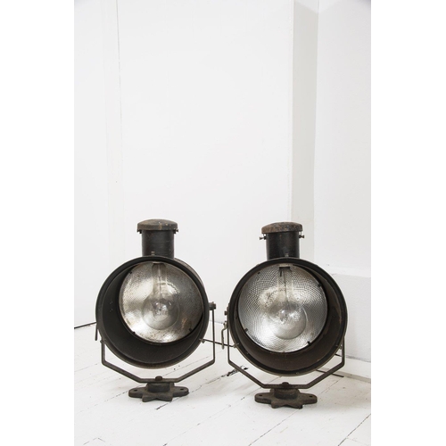 667 - A pair of early 20th century stage lights, with mercury glass reflectors and original paint finish, ... 