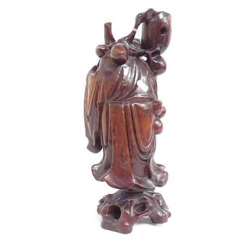 544 - A Chinese carved rootwood lamp base in the form of a travelling man, early to mid-20th century, heig... 