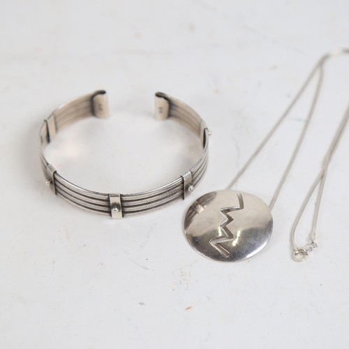 878 - A sterling silver bangle, and a stylised pendant necklace, all marked 925