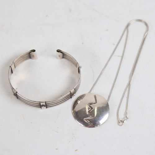 878 - A sterling silver bangle, and a stylised pendant necklace, all marked 925