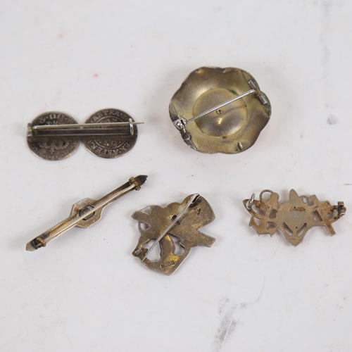 881 - A silver-gilt brooch, a silver maritime design brooch, a coin set brooch, and another etc