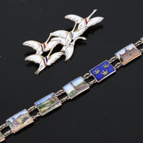 883 - ERIK MAGNUSSEN - a sterling silver and enamel while geese design brooch, and a silver and coloured e... 