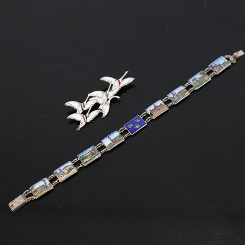 883 - ERIK MAGNUSSEN - a sterling silver and enamel while geese design brooch, and a silver and coloured e... 