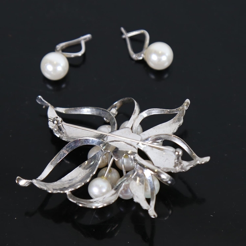 885 - A large Japanese silver and pearl set spray design brooch and a pair of earrings, by Mitsukoshi, mar... 