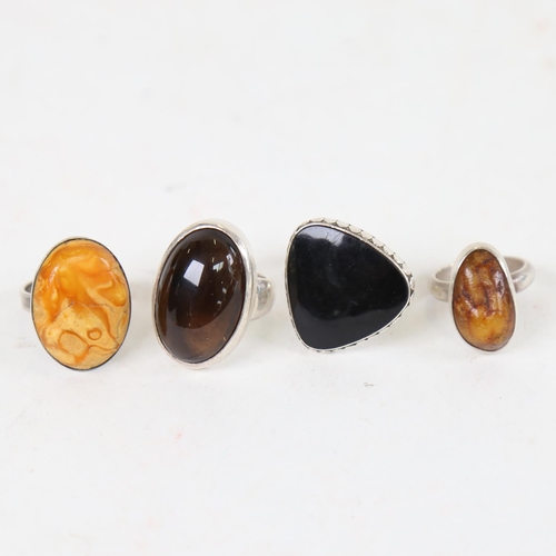 901 - A sterling silver and amber set ring, by Christian Elbro Jensen, and 3 others