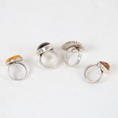 901 - A sterling silver and amber set ring, by Christian Elbro Jensen, and 3 others