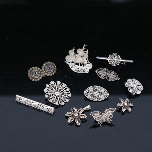 919 - 11 Scandinavian silver filigree pendants and brooches, including a galleon and butterfly