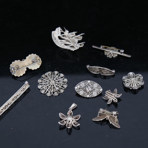 919 - 11 Scandinavian silver filigree pendants and brooches, including a galleon and butterfly