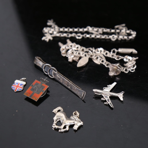 922 - Various silver charm bracelets, Georg Jensen Kingmark badge etc