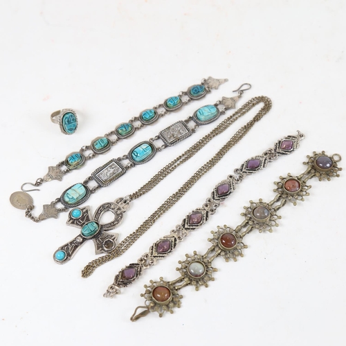 927 - A collection of Eastern jewellery, to include scarab stone set panel bracelets, an agate panel brace... 