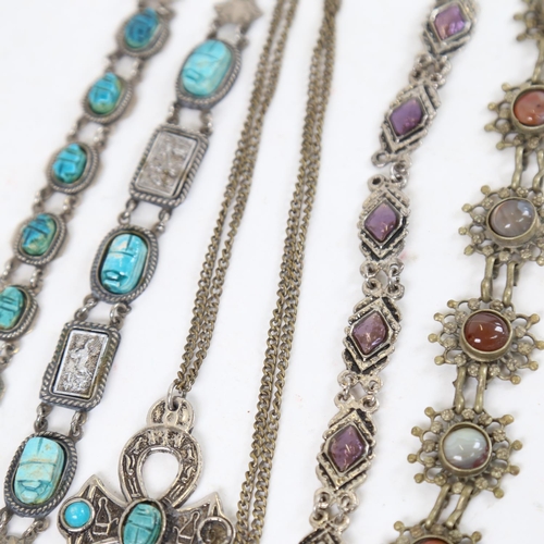 927 - A collection of Eastern jewellery, to include scarab stone set panel bracelets, an agate panel brace... 