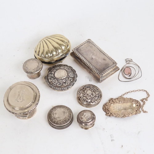 938 - A group of silver items, to include scent bottle lids, wine decanter, and a small rectangular box