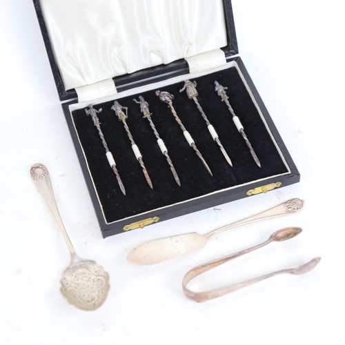 948 - A cased set of 6 silver cocktail sticks with figural ends, a silver jam spoon and knife, and a pair ... 