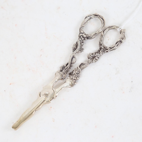 949 - A pair of Continental cast-silver grape scissors, with berry and leaf embossed decoration, marked 80... 