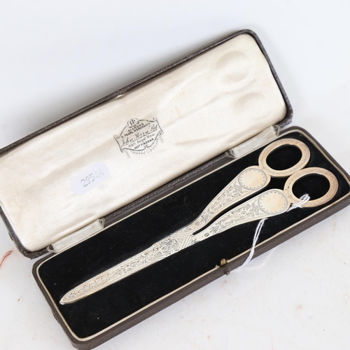 950 - A pair of Victorian silver grape scissors, with allover engraved decoration, maker's marks JA and JS... 