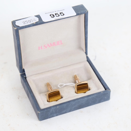 955 - A pair of 9ct gold cufflinks with tigers eye panels