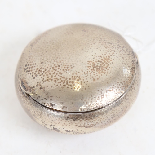 956 - An unmarked hammered silver snuffbox, with gilded interior