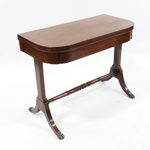 243 - WITHDRAWN - A Regency mahogany fold over card table on stretcher base, width 90cm