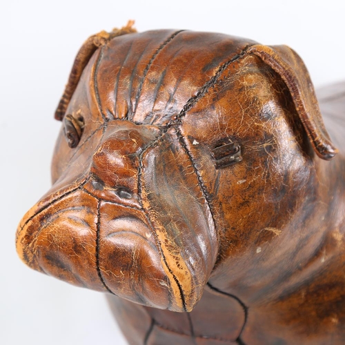 103 - A Liberty leather-covered Bulldog stool, stamped Liberty on underside of ear, length 66cm, height 48... 