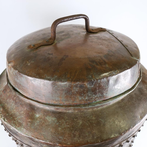 105 - A large 19th century riveted copper pot and cover, overall diameter 58cm, height excluding handle 68... 