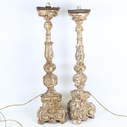 109 - A pair of 18th century carved gilt-wood candle stands, height 60cm