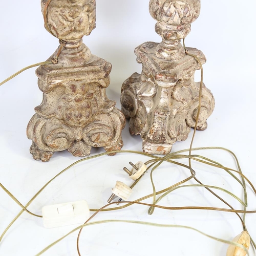 109 - A pair of 18th century carved gilt-wood candle stands, height 60cm