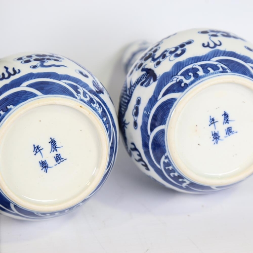 112 - A pair of Chinese blue and white porcelain narrow-necked dragon vases, 4 character marks, height 21c... 