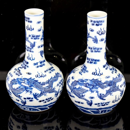 112 - A pair of Chinese blue and white porcelain narrow-necked dragon vases, 4 character marks, height 21c... 