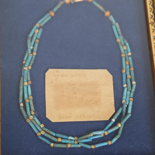 114 - An Ancient Egyptian faience bead triple-strand necklace, framed with old collection label, and 1 oth... 