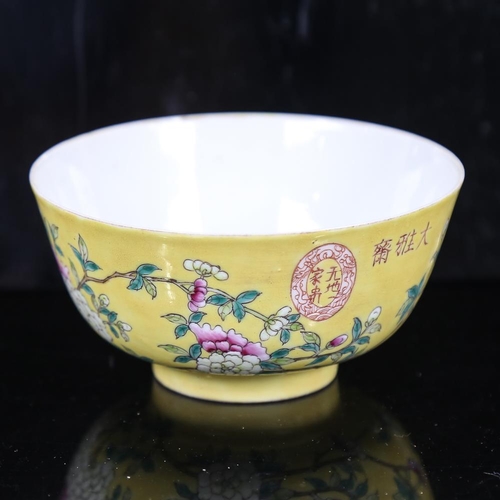 116 - A Chinese yellow glaze porcelain bowl, with polychrome flowers, seal mark, diameter 11.5cm