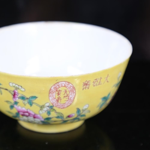 116 - A Chinese yellow glaze porcelain bowl, with polychrome flowers, seal mark, diameter 11.5cm